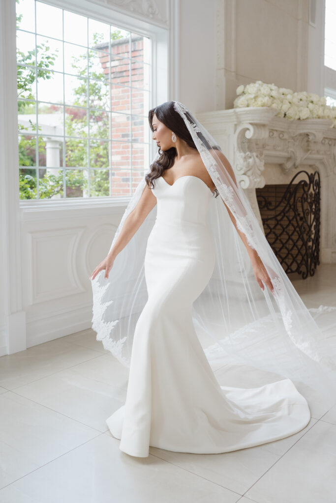 bride getting ready photos in the ceremony space at the estate at florentine gardens nj by suess moments photography