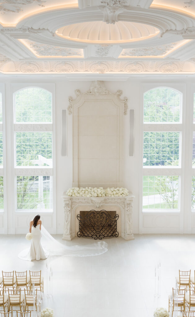 bride getting ready photos in the ceremony space at the estate at florentine gardens nj by suess moments photography