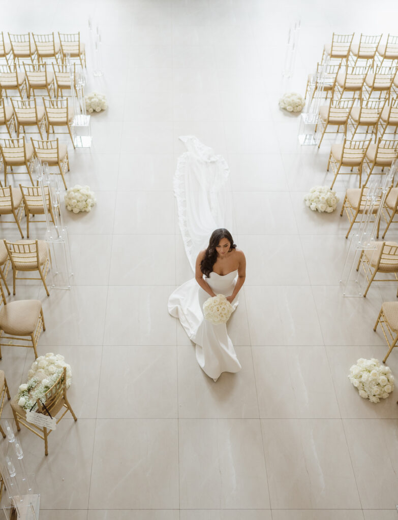 bride getting ready photos in the ceremony space at the estate at florentine gardens nj by suess moments photography