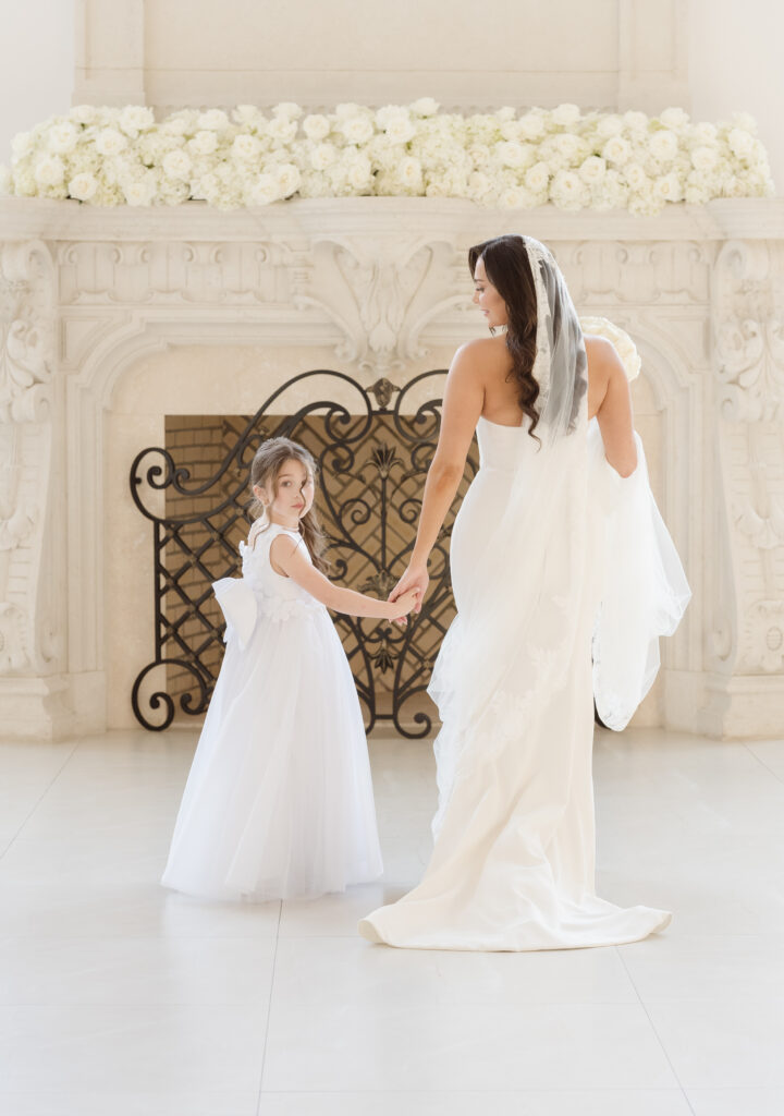 bride and flower girl walking shot