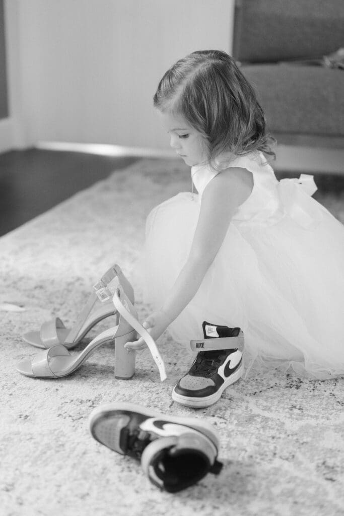 flower girl with her shoes on wedding day