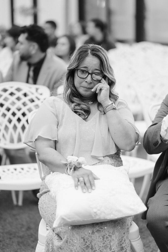 mother of groom crying during ceremony