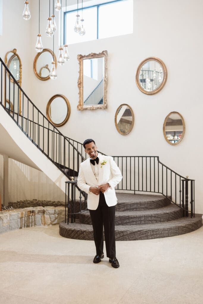 groom at the staircase at perona farms the reserve