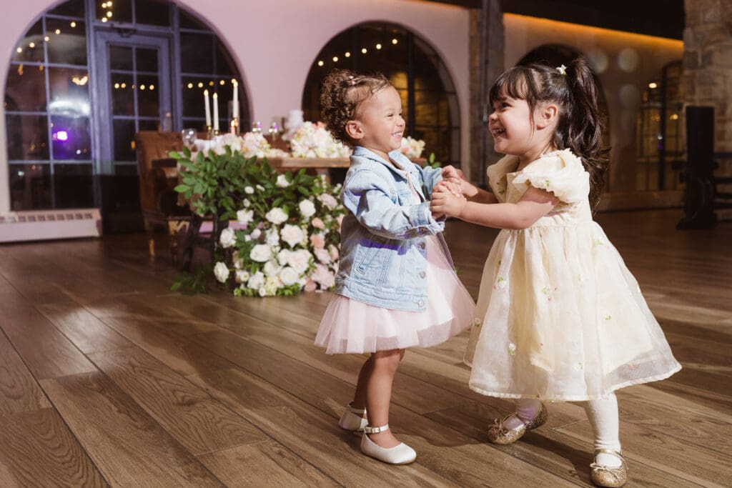 flower girls dancing at the reception