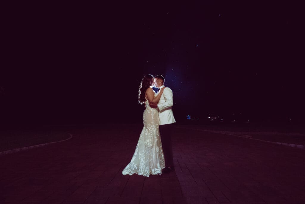 whimsical wedding photos by suess moments night shot with rain at perona farms NJ