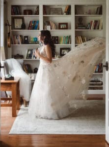 bride getting ready with the help from mom and maid of honor