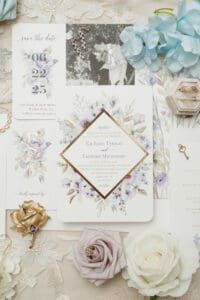 purple and blue floral wedding flatlay