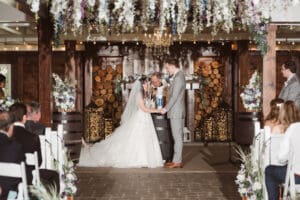 wedding ceremony in the barn at the hamilton manor nj