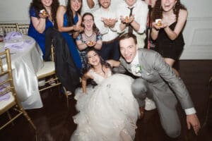 wild reception party when couple does table dash photos